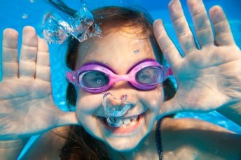 45903156 - funny underwater portrait of  cheerful girl